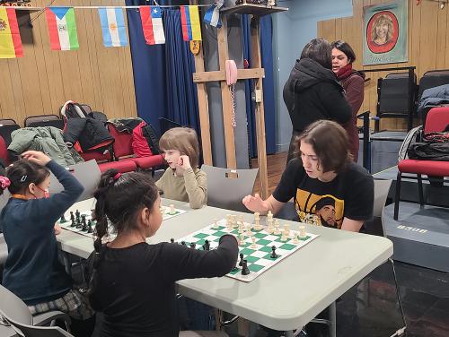 Kaleb teaching chess