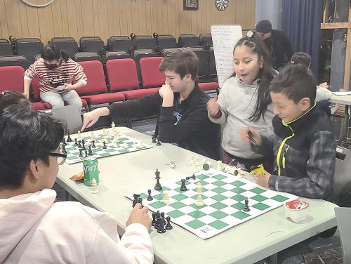 Voluntarios de Chess in the Schools 