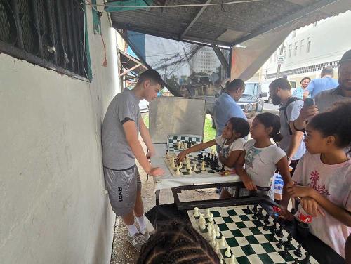 Boy learning chess on the streets