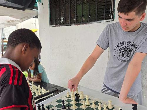 Kyle teaches chess in Panama shanty town