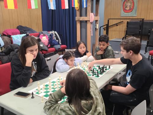 Kyle Lancman and Raydili teaching chess